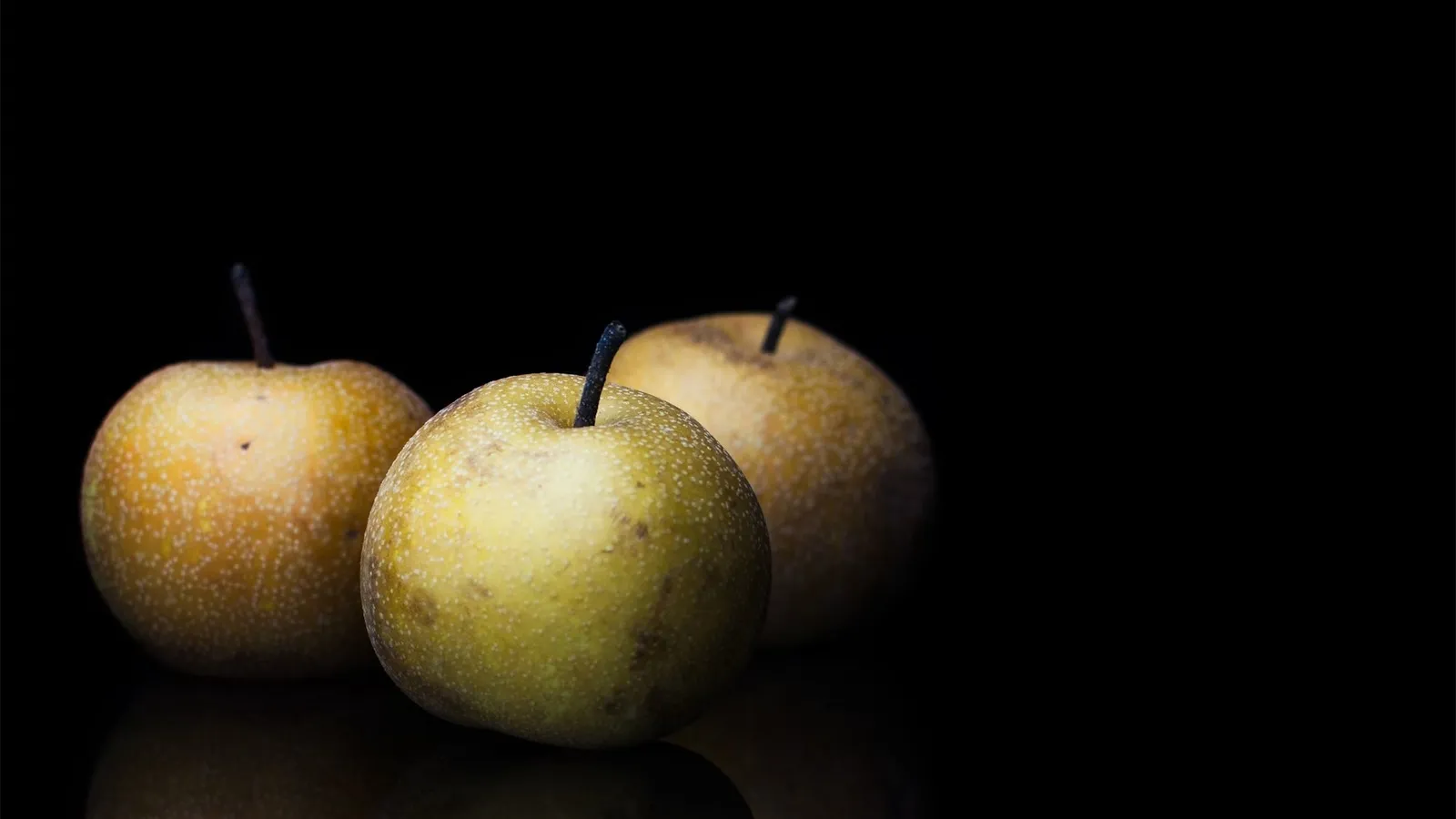 Whole Nashi pear photographed for nutrition context, a low-calorie Australian autumn fruit